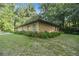 House exterior with stucco siding, green landscaping and a corner view at 7679 S Magnolia Ave, Ocala, FL 34476