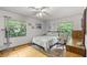 Bedroom with a double bed, rocking chair, and window at 7679 S Magnolia Ave, Ocala, FL 34476