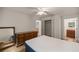 Bedroom with double bed, dresser, and mirrored closet at 7679 S Magnolia Ave, Ocala, FL 34476