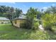 One-story house with a green metal roof and stone accents at 7679 S Magnolia Ave, Ocala, FL 34476