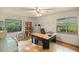 Home office with a desk, shelving, and window at 7679 S Magnolia Ave, Ocala, FL 34476