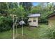Backyard with various garden decorations and sheds at 7679 S Magnolia Ave, Ocala, FL 34476
