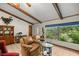 Bright living room with large windows and comfortable seating at 7679 S Magnolia Ave, Ocala, FL 34476