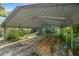 Covered carport providing shade and protection for vehicles at 7679 S Magnolia Ave, Ocala, FL 34476
