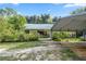 Single-story home with carport and landscaping at 7679 S Magnolia Ave, Ocala, FL 34476
