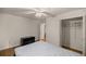 Spacious bedroom with ceiling fan, wood floors, and built-in wardrobe at 7679 S Magnolia Ave, Ocala, FL 34476
