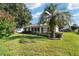 Backyard view of house with lush landscaping at 9500 Sw 93Rd Loop, Ocala, FL 34481