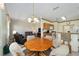Casual dining area with a round table and chairs, adjacent to the kitchen at 9500 Sw 93Rd Loop, Ocala, FL 34481