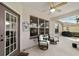 Cozy patio with seating area, adjacent to the home's entrance at 9500 Sw 93Rd Loop, Ocala, FL 34481