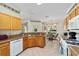 Kitchen features granite countertops, wood cabinets, and breakfast nook at 9500 Sw 93Rd Loop, Ocala, FL 34481