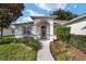 Inviting home exterior with landscaped walkway at 9500 Sw 93Rd Loop, Ocala, FL 34481