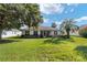 Backyard view of house with large grassy area at 9500 Sw 93Rd Loop, Ocala, FL 34481