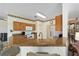 Kitchen with granite countertops, wood cabinets, and modern appliances at 9500 Sw 93Rd Loop, Ocala, FL 34481