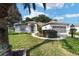 Home exterior showcasing manicured lawn and driveway at 9500 Sw 93Rd Loop, Ocala, FL 34481