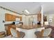 Kitchen boasts granite countertops, wood cabinets, and breakfast bar at 9500 Sw 93Rd Loop, Ocala, FL 34481