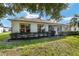 Single-story home with screened patio and well-maintained landscaping at 9500 Sw 93Rd Loop, Ocala, FL 34481