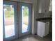 French doors leading to the backyard from the kitchen at 13260 Se 33Rd Ct, Belleview, FL 34420