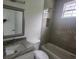 Bathroom with a tub and granite countertop at 13260 Se 33Rd Ct, Belleview, FL 34420