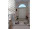 Bathroom featuring a bathtub, window, and floral wallpaper at 9530 Sw 189Th Ct, Dunnellon, FL 34432