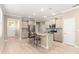 Island kitchen with stainless steel appliances and light cabinets at 9818 Sw 99Th Loop, Ocala, FL 34481