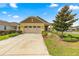 Exterior view of two-car garage and driveway at 9818 Sw 99Th Loop, Ocala, FL 34481