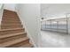 View of garage with car door and staircase at 9818 Sw 99Th Loop, Ocala, FL 34481