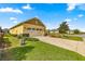 Home exterior showcasing garage and landscaping at 9818 Sw 99Th Loop, Ocala, FL 34481