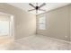 Bright bedroom with ceiling fan and carpet flooring at 9818 Sw 99Th Loop, Ocala, FL 34481