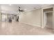 Open living room with views into the kitchen and access to other rooms at 9818 Sw 99Th Loop, Ocala, FL 34481