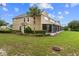Two-story house with a screened patio and palm tree at 4230 Sw 50Th Cir, Ocala, FL 34474