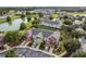 Aerial view of townhouses, lake, and surrounding community landscape at 4230 Sw 50Th Cir, Ocala, FL 34474