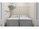 Laundry room with washer, dryer, and overhead shelving at 4230 Sw 50Th Cir, Ocala, FL 34474