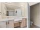 Bathroom with double vanity, large mirror, and access to toilet at 4230 Sw 50Th Cir, Ocala, FL 34474