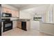 Kitchen with view into living room and access to backyard at 4230 Sw 50Th Cir, Ocala, FL 34474