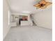 Large living room with carpeted floor, staircase and kitchen views at 4230 Sw 50Th Cir, Ocala, FL 34474