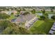 Aerial view of a tan townhouse with screened porch and green surroundings at 4230 Sw 50Th Cir, Ocala, FL 34474