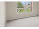 Bedroom with large window and neutral wall-to-wall carpeting at 4230 Sw 50Th Cir, Ocala, FL 34474