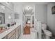 Guest bathroom with toilet and vanity at 13783 Se 8Th Ct, Ocala, FL 34480