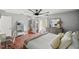 Bright bedroom with wood floors, ceiling fan, and ample closet space at 13783 Se 8Th Ct, Ocala, FL 34480