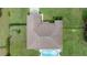 Overhead view of a house featuring a large, brown roof and pool at 13783 Se 8Th Ct, Ocala, FL 34480