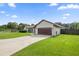 Single-story home with attached garage and spacious lawn at 13783 Se 8Th Ct, Ocala, FL 34480