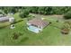 Aerial view showcasing a single-story house with a private pool at 13783 Se 8Th Ct, Ocala, FL 34480