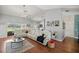 Bright living room, hardwood floors, sectional sofa, and high ceilings at 13783 Se 8Th Ct, Ocala, FL 34480