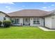 Charming single story home with a white exterior and blue accents at 13783 Se 8Th Ct, Ocala, FL 34480