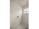 Clean shower with tiled walls and neutral color palette at 13783 Se 8Th Ct, Ocala, FL 34480