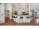 Modern kitchen with an island and seating for four at 13783 Se 8Th Ct, Ocala, FL 34480