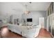 Living area with hardwood floors and a comfy sectional sofa at 13783 Se 8Th Ct, Ocala, FL 34480