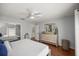 Bedroom with a king-size bed and a large dresser at 13783 Se 8Th Ct, Ocala, FL 34480