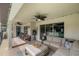 Relaxing patio with seating area, ceiling fans, and access to the pool at 13783 Se 8Th Ct, Ocala, FL 34480
