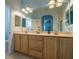 Primary bathroom with double sinks and a large mirror at 8655 Sw 86Th Cir, Ocala, FL 34481